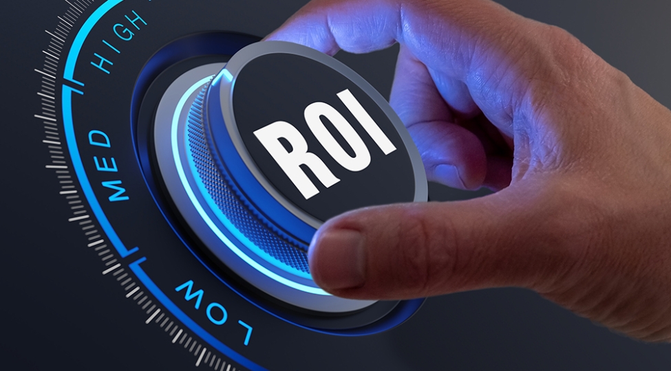 A hand turning a dial labeled ROI